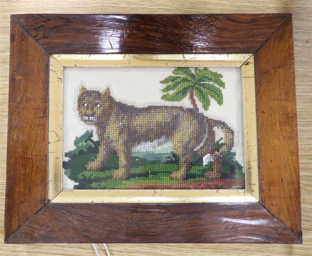 A Victorian needlework panel of a lion